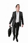 Businessman Carrying A Suitcase Stock Photo
