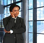 Businessman Chatting On The Phone Stock Photo