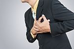 Businessman Having Heart Attack Stock Photo