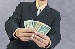 Businessman Holding Money Cash Dollars In Hands Stock Photo