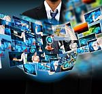 Businessman Holding Reaching Images Streaming In Hands Stock Photo