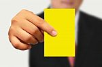 Businessman Showing Yellow Paper Stock Photo