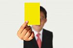 Businessman Showing Yellow Paper Stock Photo