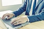 Businessman Typing Or Working With Laptop Or Notebook Vintage Style Stock Photo