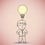 Businessman With Idea Light Bulb Stock Photo
