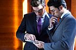 Businessmen With Digital Tablet  In Modern Office Stock Photo