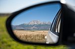 Car Rear View Of High Mountains Stock Photo