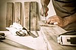 Carpenter Hammer A Nail, Vintage Style Stock Photo