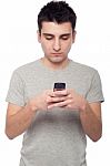 Casual Man Text Messaging Stock Photo