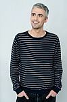 Casual Shot Of Smiling Relaxed Male Model Stock Photo