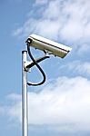 Cctv Camera On Blue Sky Background Stock Photo