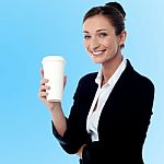 Cheerful Business Lady Holding Beverage Stock Photo