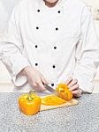 Chef Cutting Bell Peppers Stock Photo