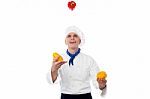 Chef Juggling With Vegetables Stock Photo