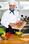 Chef Putting Vegetables In A Bowl Stock Photo