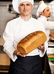Chef Showing Freshly Baked Whole Grain Bread Stock Photo