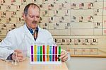 Chemist Filling Glass Tubes With Colored Liquids Stock Photo