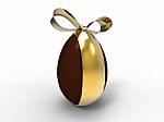 Chocolate Egg With Golden Ribbon Stock Photo
