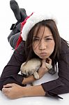 Christmas Lady Lying With Puppy Stock Photo