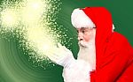 Christmas Theme, Santa Claus With Magic Lights Stock Photo