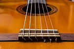 Classical Guitar And Strings And The Bridge Stock Photo