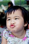 Close Up Face Of Lovely And Cute Asian Baby Making Funny Mouth Stock Photo