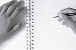 Close Up Of Man's Hands Writing In Spiral Notepad Stock Photo