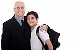 Close Up Shot Of Old Business Man Embraces A Teenager Stock Photo