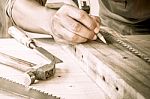 Close Up View Of A Carpenter Using A Straightedge To Draw A Line Stock Photo