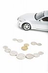 Coins On White With Car Stock Photo