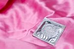 Condom pack On Pink background Stock Photo