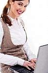 Cute Girl Typing On Laptop Stock Photo