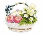 Different Fruits And Flowers In Wicker Basket Stock Photo