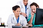 Doctor Team Making Discussion Over Phone Stock Photo