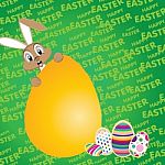 Easter Bunny With Big Egg On A Green Background. Happy Easter Day For Colorful Egg Stock Photo
