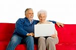 Elderly Couple With Laptop Stock Photo