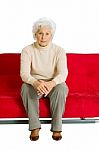 Elderly Woman On The Couch Stock Photo