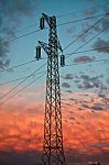 Electricity Pylon At Sunset Stock Photo