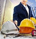 Engineer Man And Working Table Against Sky Scrapper In Urban Scene Use For Land Development And Architecture Occupation Theme Stock Photo
