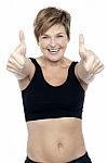 Excited Attractive Fit Lady Showing Double Thumbs Up Stock Photo
