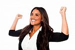 Excited Woman With Arms Raised Stock Photo