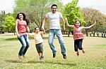 Family Jumping Together Stock Photo