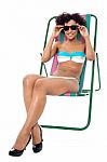 Fashion Lingerie Model Relaxing On Deckchair Stock Photo