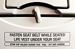 Fasten Seat Belt While Seated Stock Photo