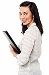 Female Assistant Holding Business Files Stock Photo