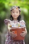 Female Child Holding Bucket Stock Photo