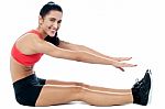 Female Gym Instructor Stretching Her Body Stock Photo