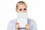 Female Model Hiding Face With Tablet Pc Stock Photo