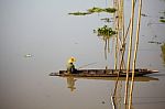 Fisherman Sitting On Boat Stock Photo