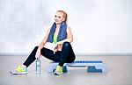 Fitness Woman Resting After Exercises In Gym Stock Photo